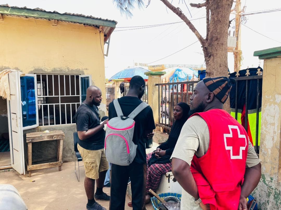 SMF and Red Cross partners collaborating in a courtyard meeting